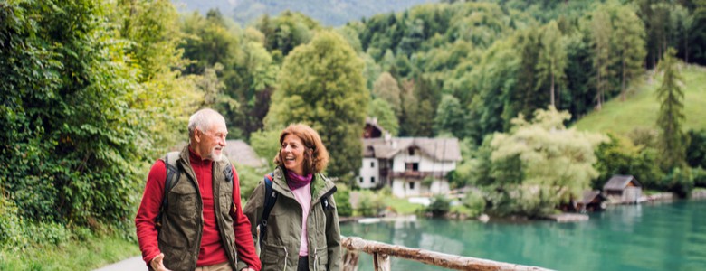 An older couple hiking.