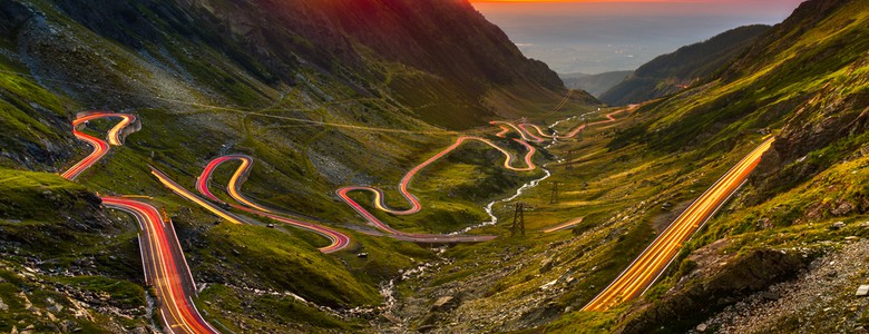 A part of the Transfagarasan road in a valley at sunset