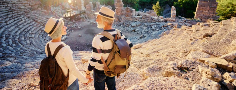 A mature couple visiting an ancient amphitheatre.