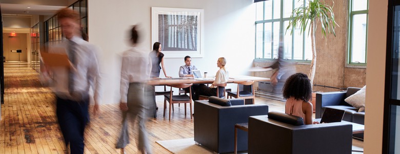 An open-plan office with people working.