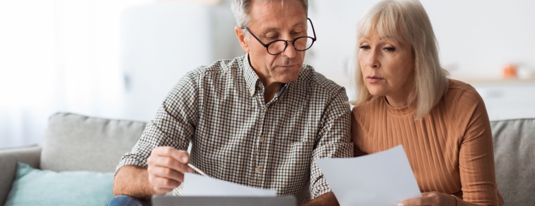 A couple reviewing paperwork together.