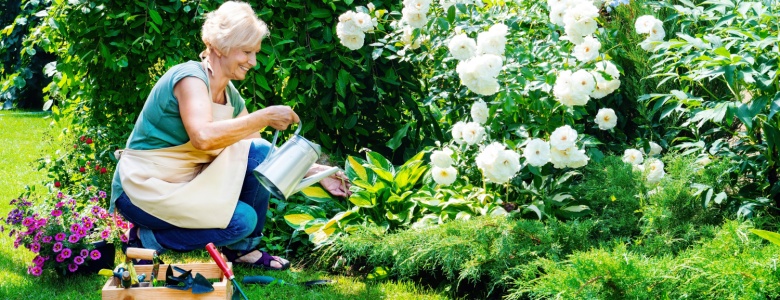 A woman tending to a garden.