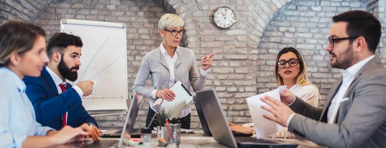 A group of colleagues sitting around a conference table.