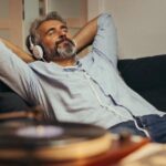 A man relaxing while listening to music.