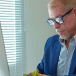 A man working at an office desk.