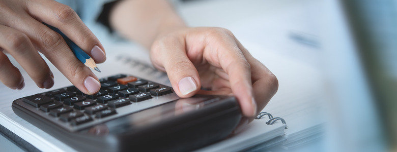 A person using a calculator.