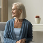 Smiling woman in an attractively furnished room