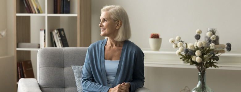 Smiling woman in an attractively furnished room