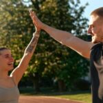A couple on a running track.