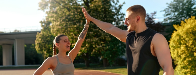 A couple on a running track.