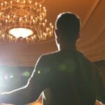 An actor rehearsing on a theatre stage.