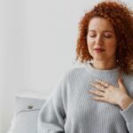 A lady focusing on her breathing.