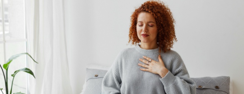 A lady focusing on her breathing.