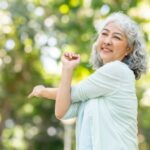 A woman stretching in a park.