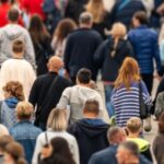 A crowd of people walking.