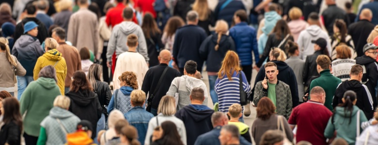 A crowd of people walking.