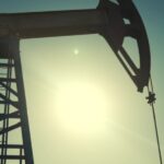 A silhouette of an oil pump.