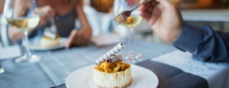 A couple enjoying a meal in a restaurant.